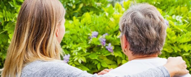 A daughter lovingly acts as her mother's informal caregiver.