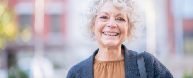 A woman is happy thanks to following good senior incontinence management practices.