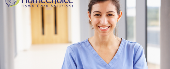A caregiver looks happy as she looks forward to her career in home care.