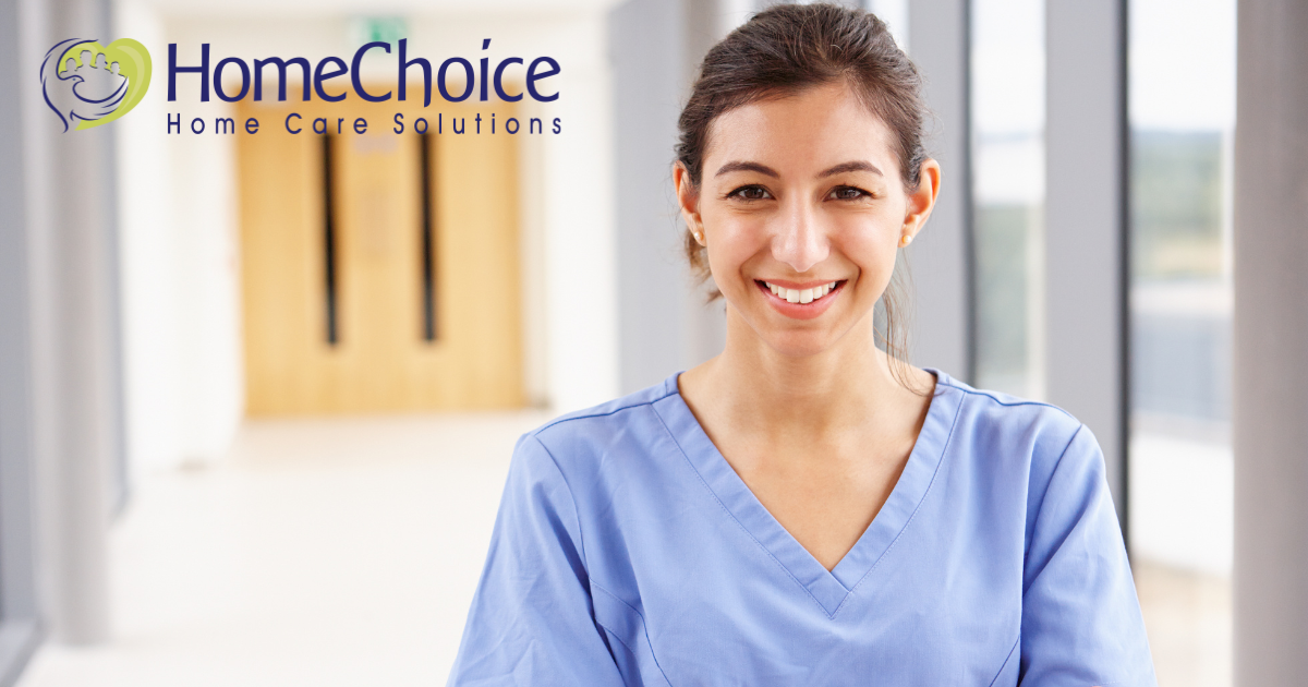 A caregiver looks happy as she looks forward to her career in home care.