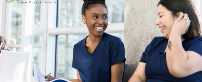 2 women study together to meet the requirements for being a professional caregiver.