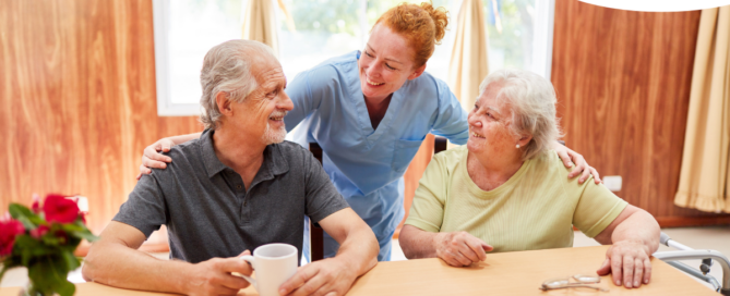 A good caregiving environment can benefit both caregiver and clients, as shown here by this caregiver and her 2 clients.