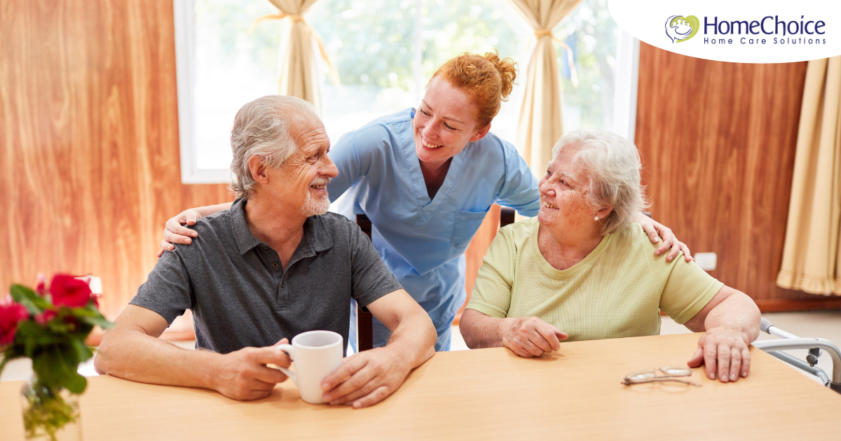 A good caregiving environment can benefit both caregiver and clients, as shown here by this caregiver and her 2 clients.