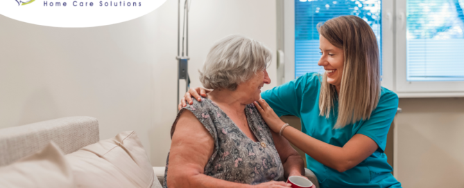 A home care provider compassionately tends to a senior client in their home.