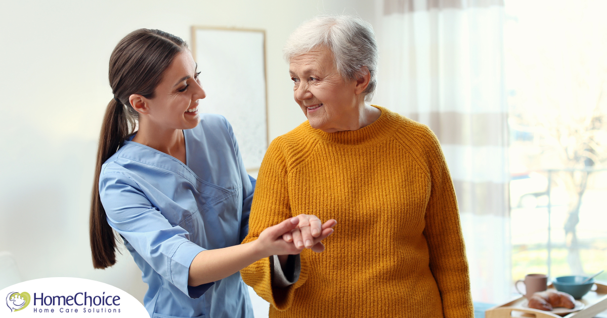 Professional caregivers, like this one who is helping a senior client walk, require a number of qualities and skills to provide compassionate personal care.