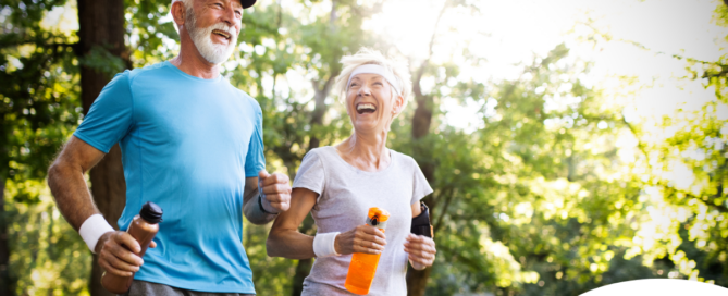 A senior couple enjoys walking outdoors, one of many activities for seniors that can help them stay healthy.