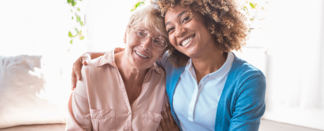 A caregiver enjoys professional caregiving as she helps a senior client.