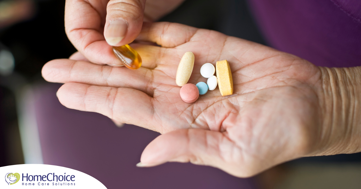 A woman holds pills in her hand, representing medication management.