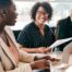 A couple talks with and advisor, representing the type of preparation that is crucial for successful senior care planning.