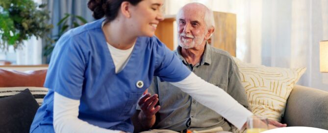 Caregiver providing senior care at home to manage parkinson’s and related symptoms.