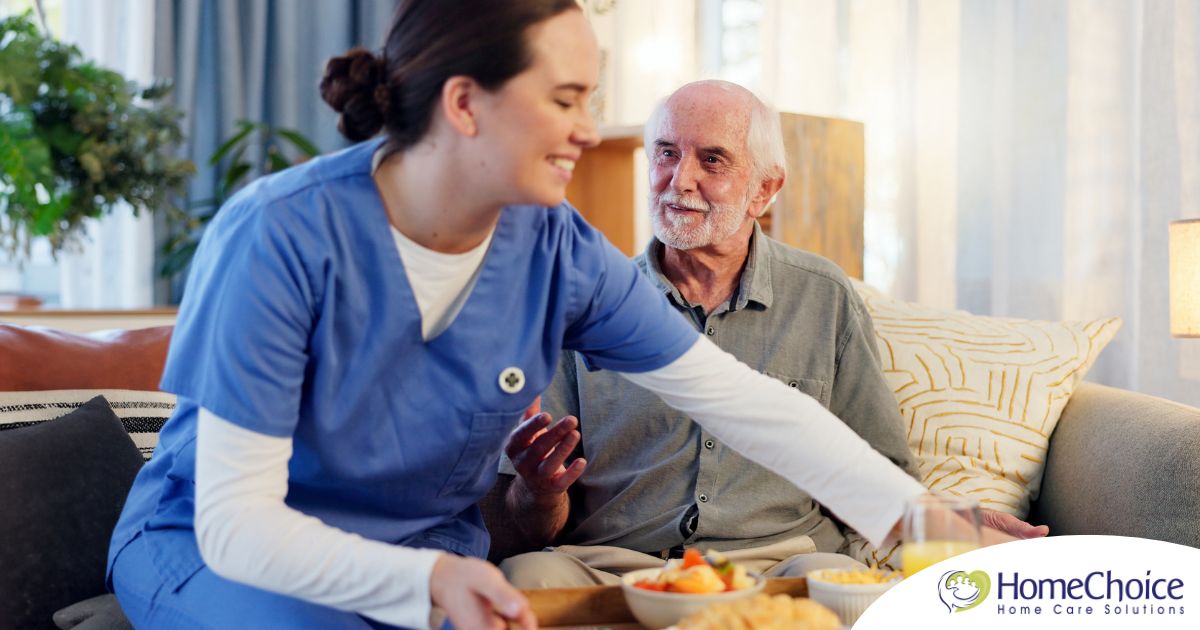Caregiver providing senior care at home to manage parkinson’s and related symptoms.