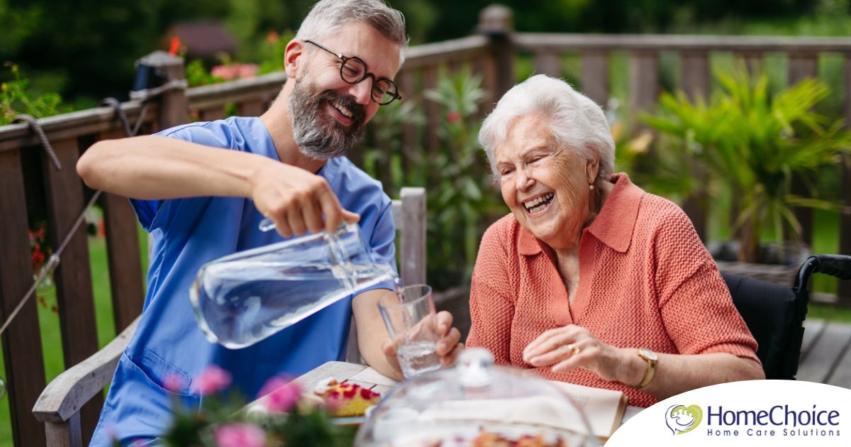 A caregiver applies summer Caregiving Tips including helping a senior stay hydrated.