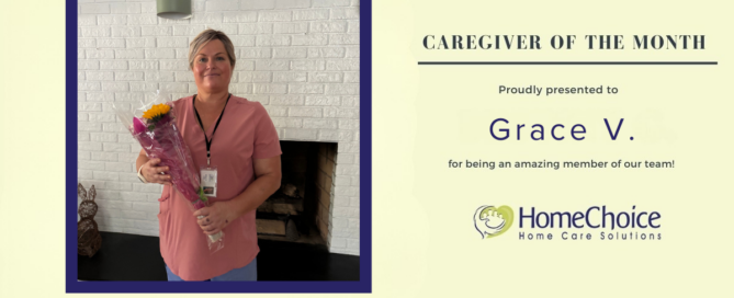 Graphic recognizing Grace V. as HomeChoice Home Care Solutions' June Caregiver of the Month. Grace is pictured smiling and holding a bouquet of flowers in front of a white brick fireplace. The graphic features the HomeChoice logo and the text, "Caregiver of the Month – Proudly presented to Grace V. for being an amazing member of our team!" in the company's signature blue and green brand colors.