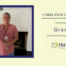 Graphic recognizing Grace V. as HomeChoice Home Care Solutions' June Caregiver of the Month. Grace is pictured smiling and holding a bouquet of flowers in front of a white brick fireplace. The graphic features the HomeChoice logo and the text, "Caregiver of the Month – Proudly presented to Grace V. for being an amazing member of our team!" in the company's signature blue and green brand colors.