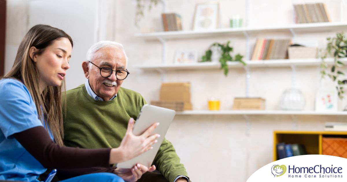 Home caregiver assisting senior man to use telehealth and senior care