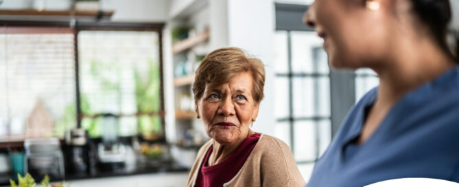 Caregiver provides attentive senior care as part of diabetes awareness