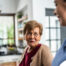 Caregiver provides attentive senior care as part of diabetes awareness