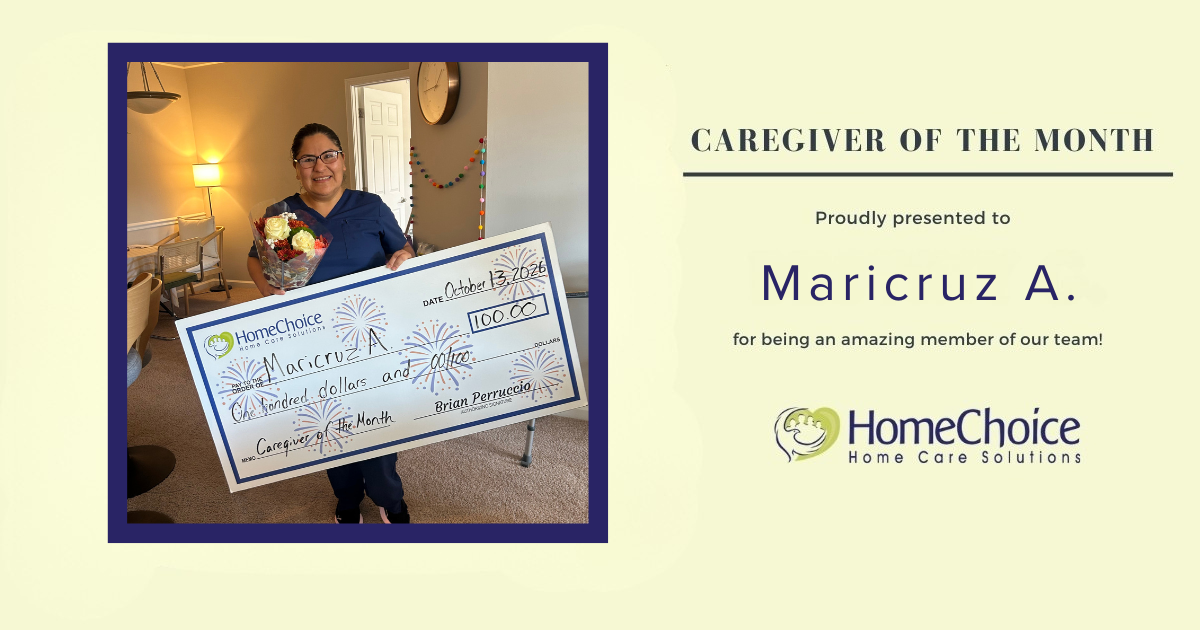 Maricruz A., HomeChoice Home Care Solutions’ October 2026 Caregiver of the Month, smiles while holding flowers and her Caregiver of the Month award check.